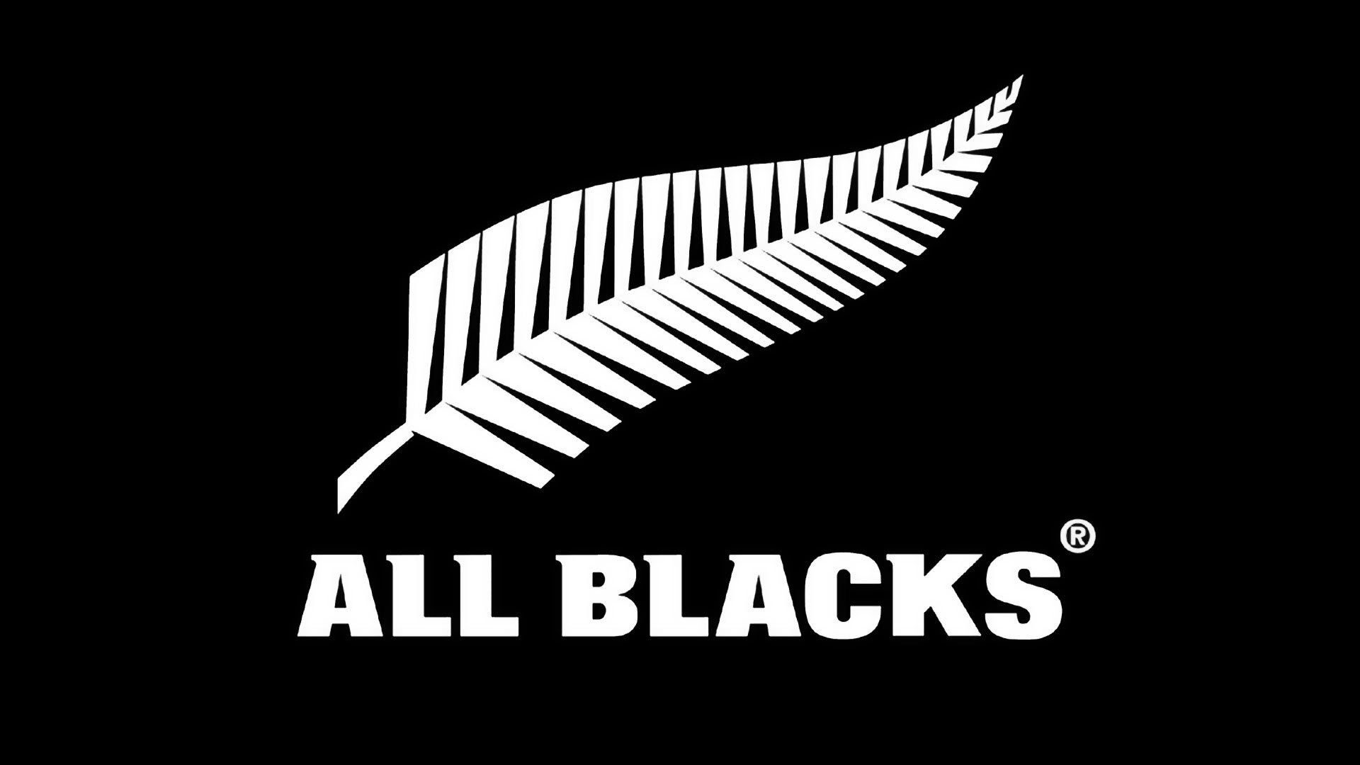 The logo of the Rugby team All Blacks, a white feather on a black background with the text `All Blacks`